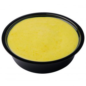 Curry sauce in a small bowl isolated